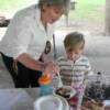 Debra Swafford w/ granson sizing up the desserts